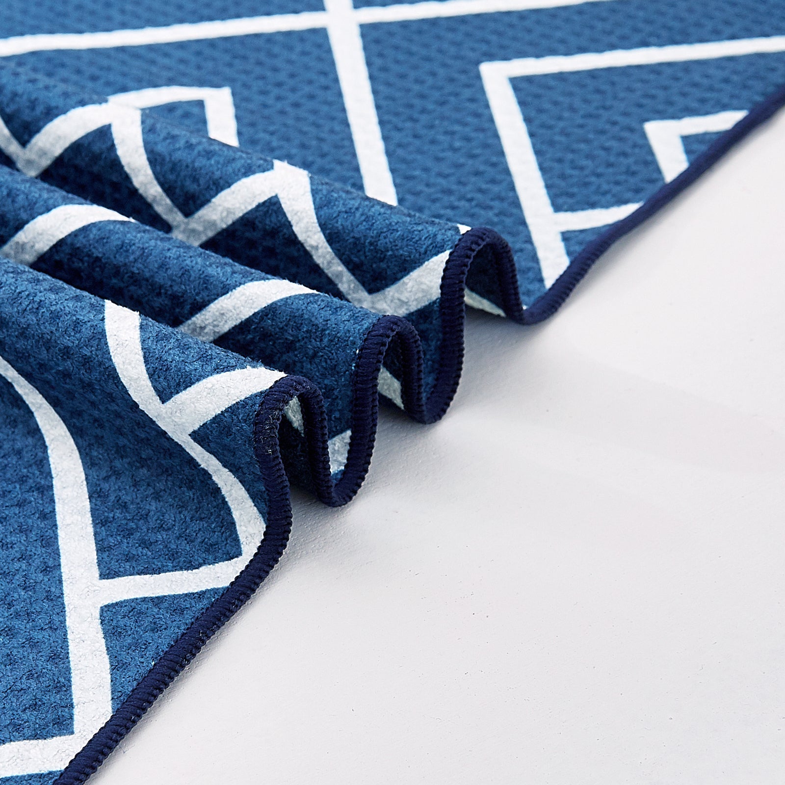 Close-up of navy waffle-weave microfibre bath towel